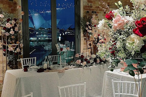 Watersedge event tables with Sydney Opera House views through the window
