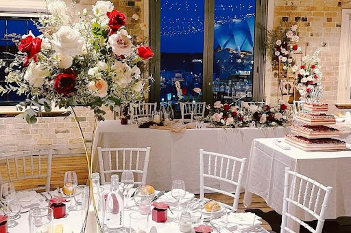 Floral event setting with Sydney Harbour behind the windows